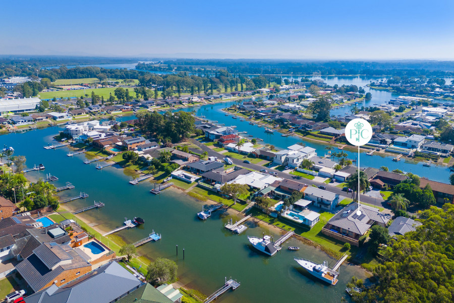 Elegant Waterfront Living with Drive-Thru Boat Ramp